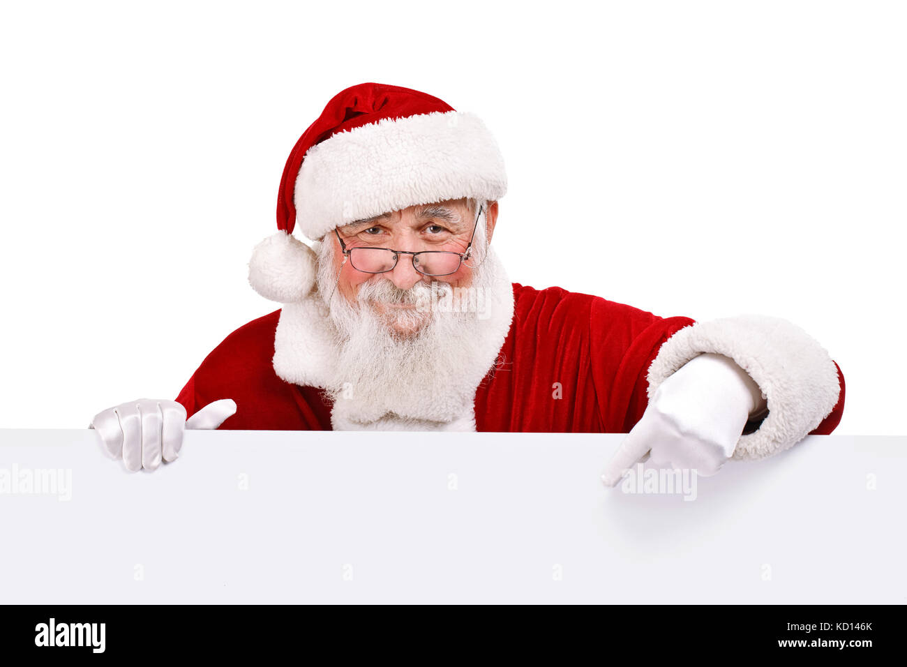 Santa Claus pointing in white blank sign with smile, isolated on white ...