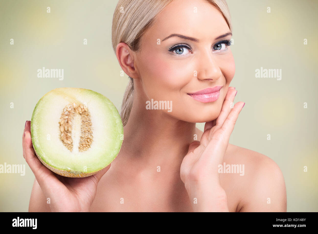 beautiful woman with perfect skin, melons for perfect complexion Stock Photo Alamy