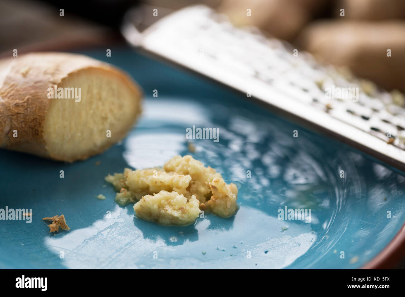 Ginger root and minced ginger on plate with shredder Stock Photo Alamy