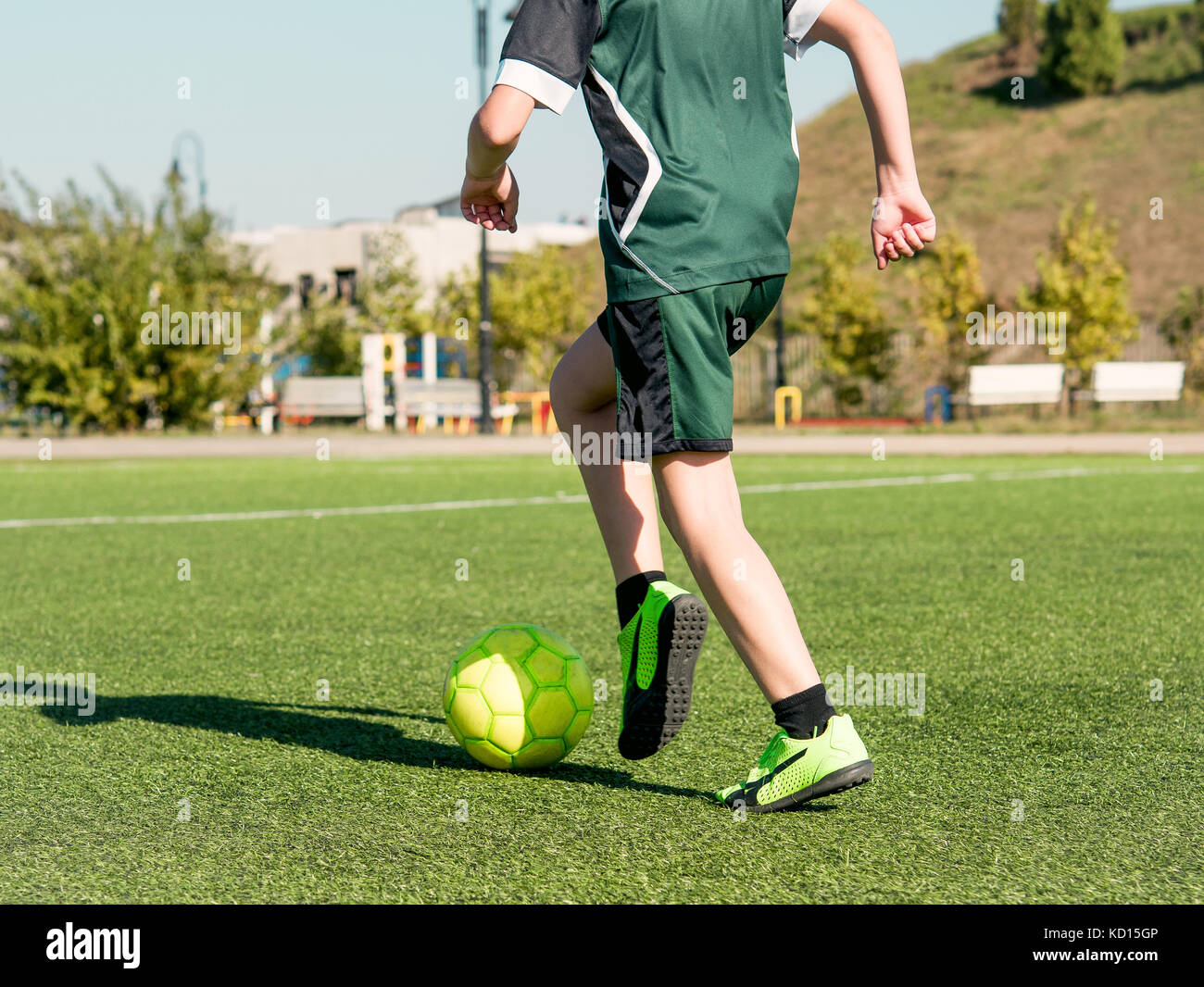 football on green field Stock Photo - Alamy