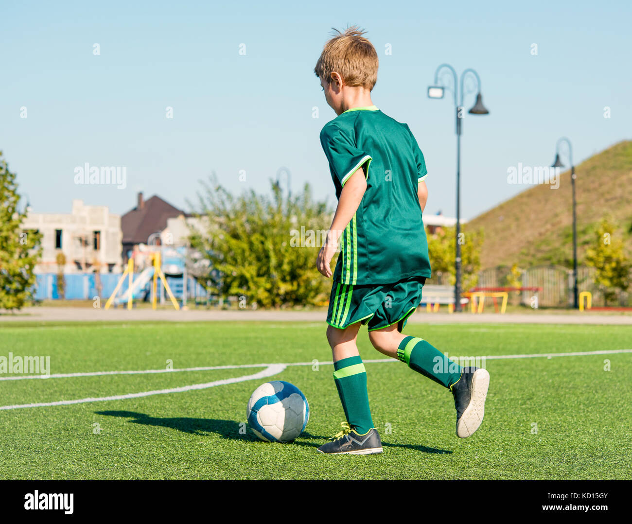 football on green field Stock Photo - Alamy