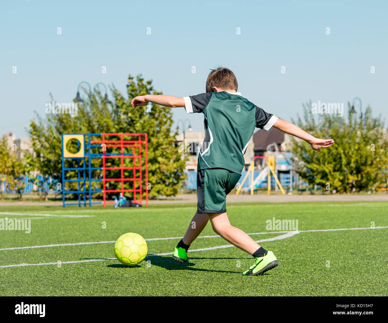 football on green field Stock Photo - Alamy