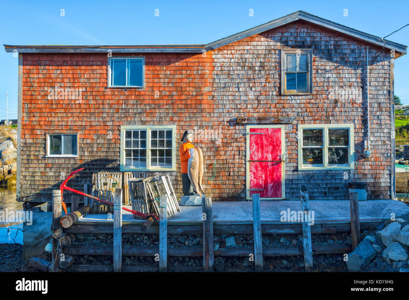 Statue and fishing shed, Peggys Cove, Nova Scotia, Canada Stock Photo