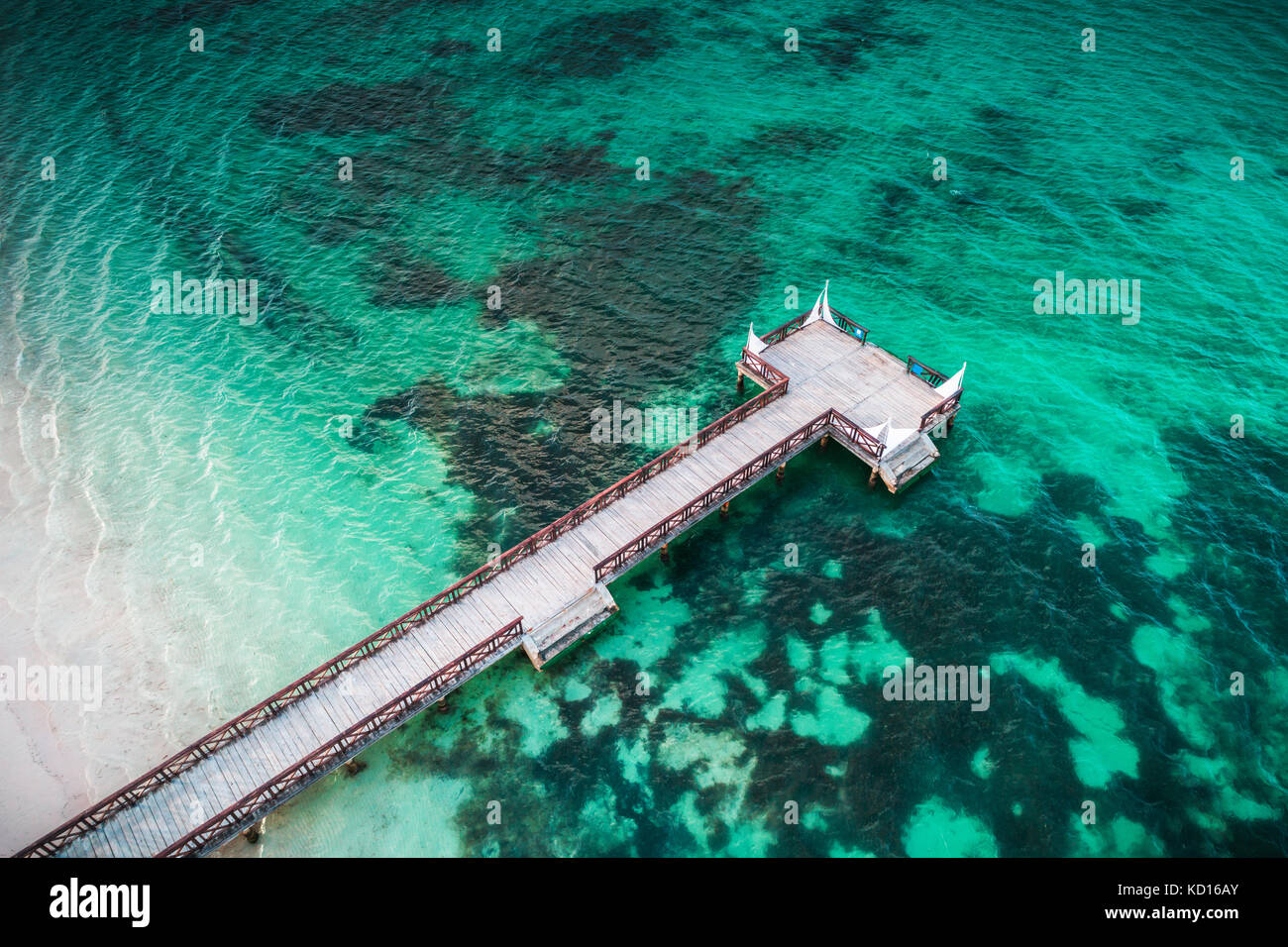 Aerial view of tropical wooden pier and turquoise caribbean sea in Punta Cana, Dominican Republic Stock Photo