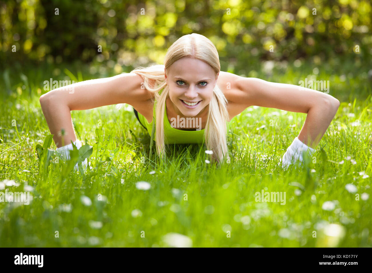 Portrait Of Young Blonde Woman Doing Push Ups Stock Photo - Alamy