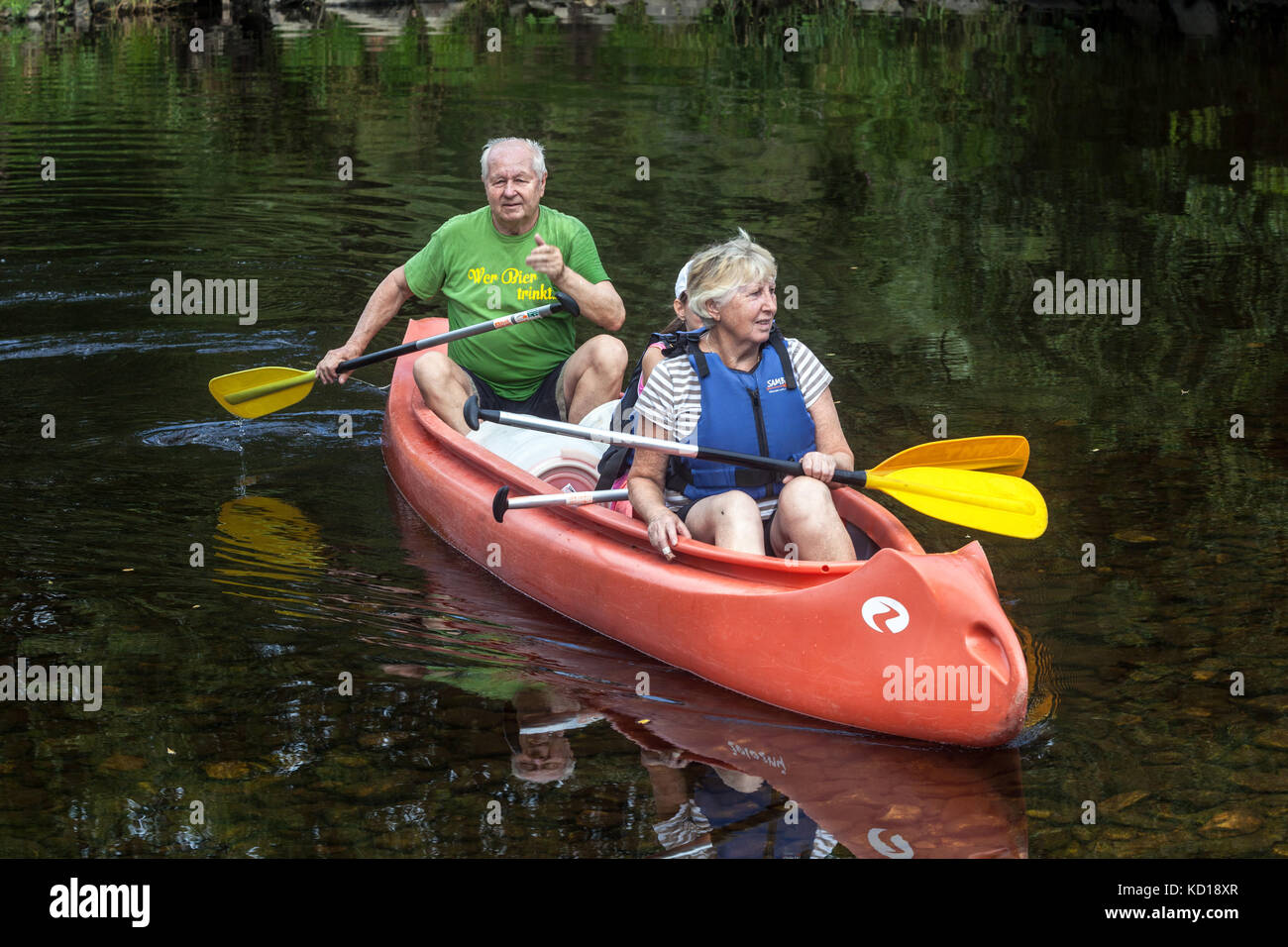 Active aging, Seniors canoeing river Otava, Vacation in summer, Czech Republic Senior couple active retirement Czech seniors Stock Photo