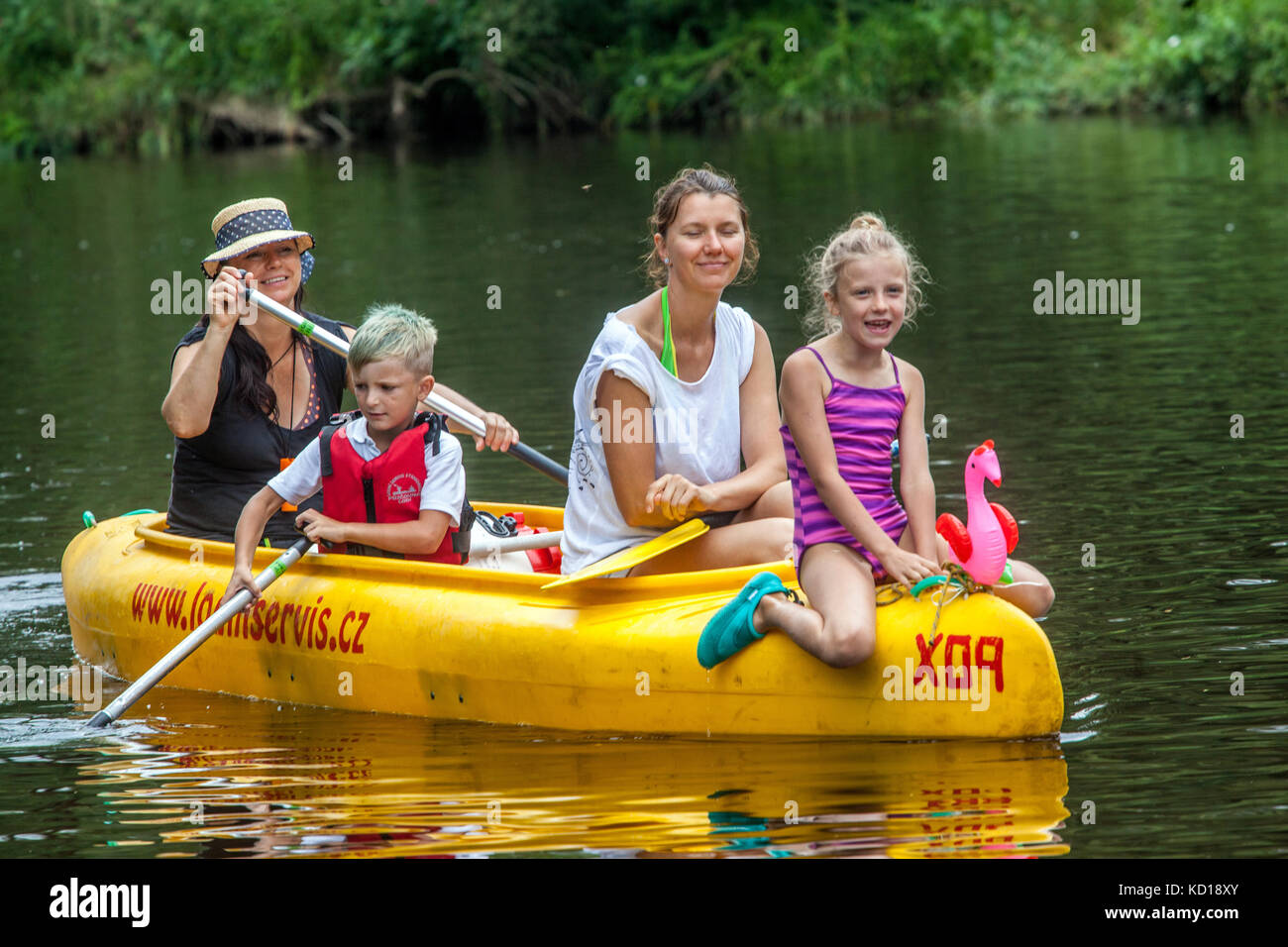 Canoeing family with three-generation Czech women, Paddlers going down by Otava river People Vacations in summer, Czech Republic family floating river Stock Photo