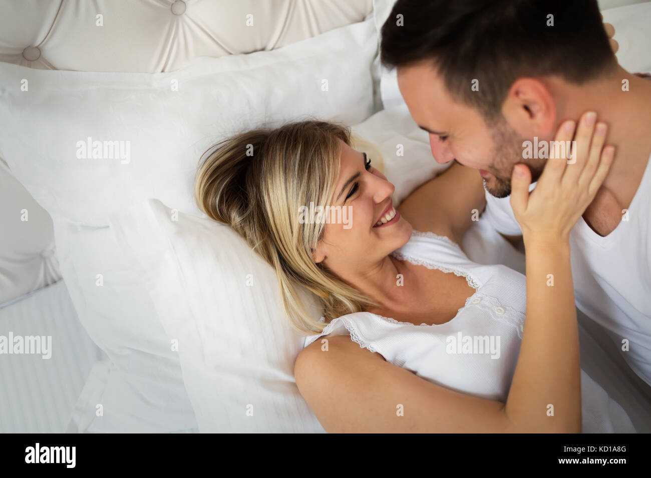 Handsome man and beautiful woman kissing each other Stock Photo