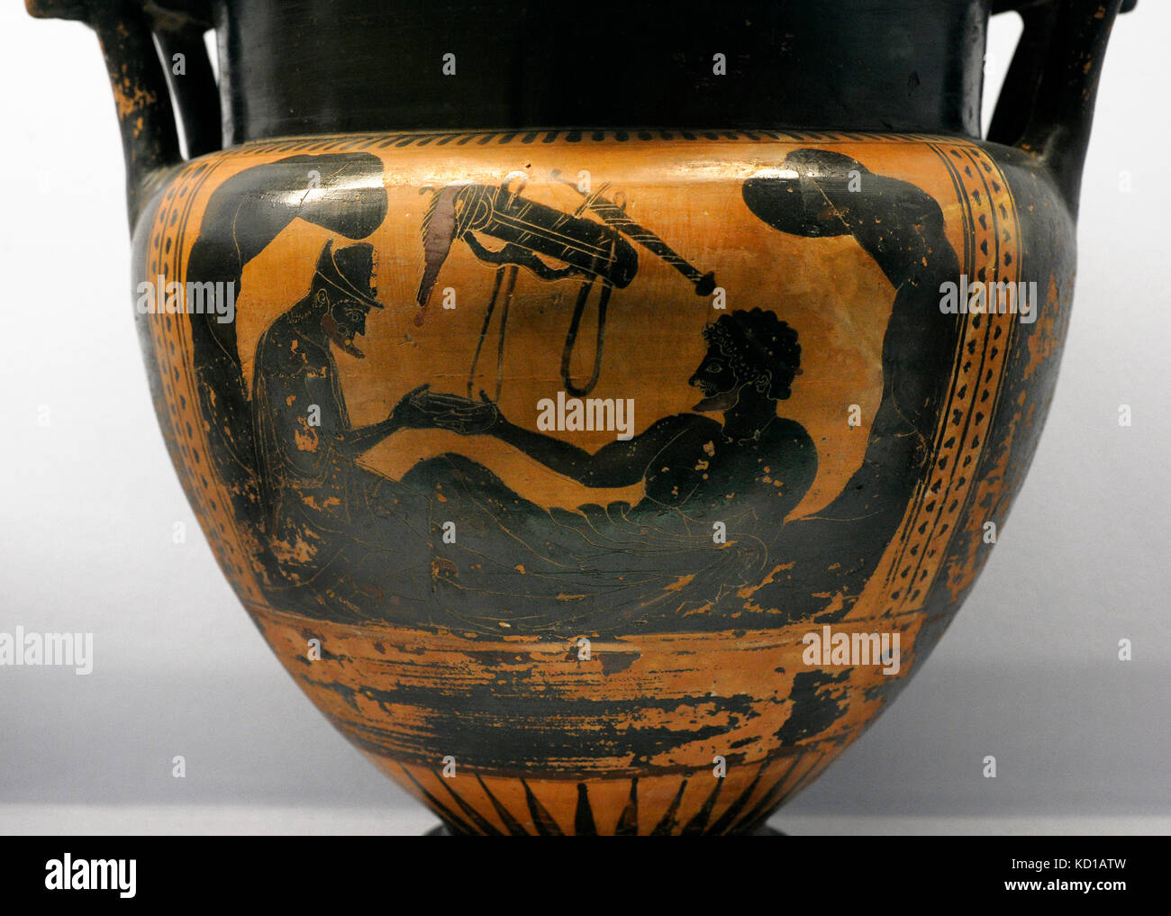 Greek krater depicting the hero Hercules and the God Hermes at a banquet in a cave. 510-500 BC. Made in Athens by the Rycroft's painter. Ceramics. Black figures. National Archaeological Museum. Naples. Italy. Stock Photo