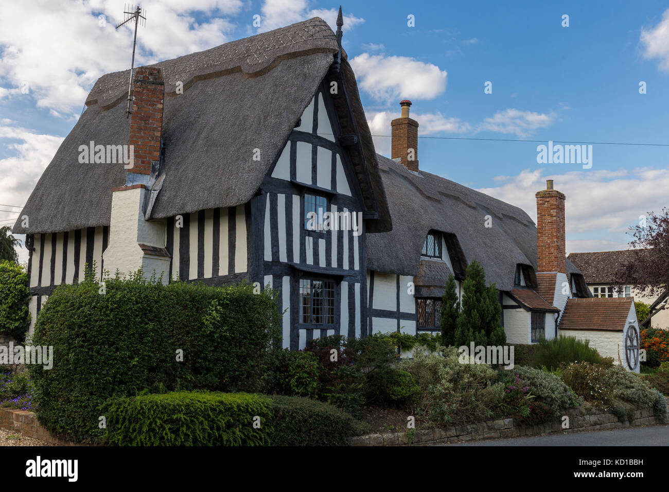 Black and white timber framed cottage with thatch roof Stock Photo