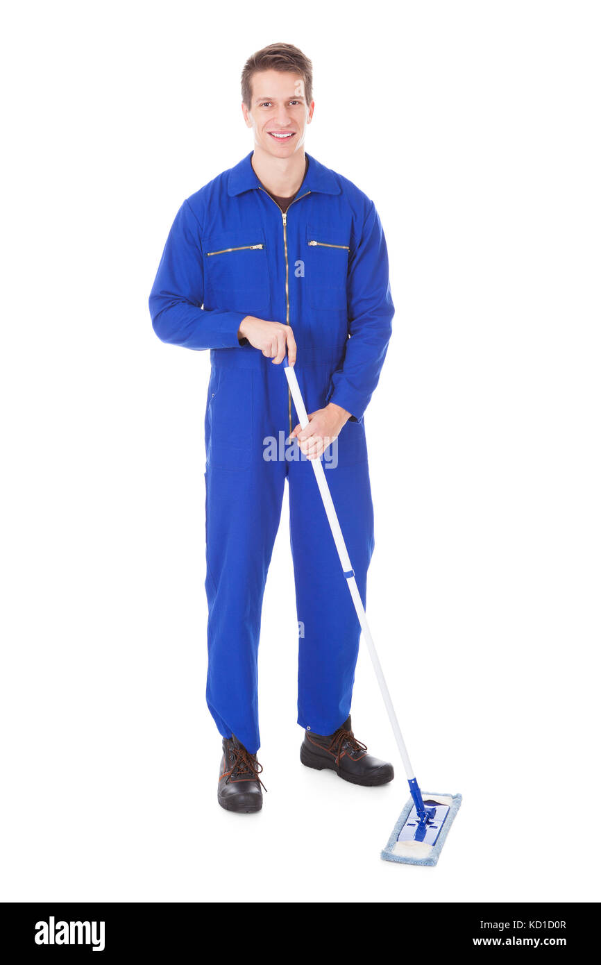 Young Male Worker In Boilersuit Cleaning Floor With Mop Stock Photo
