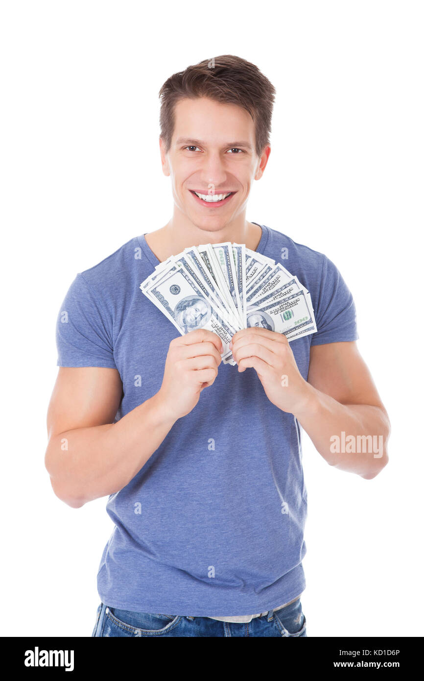 Portrait Of Happy Young Man Holding American Dollars Over White ...