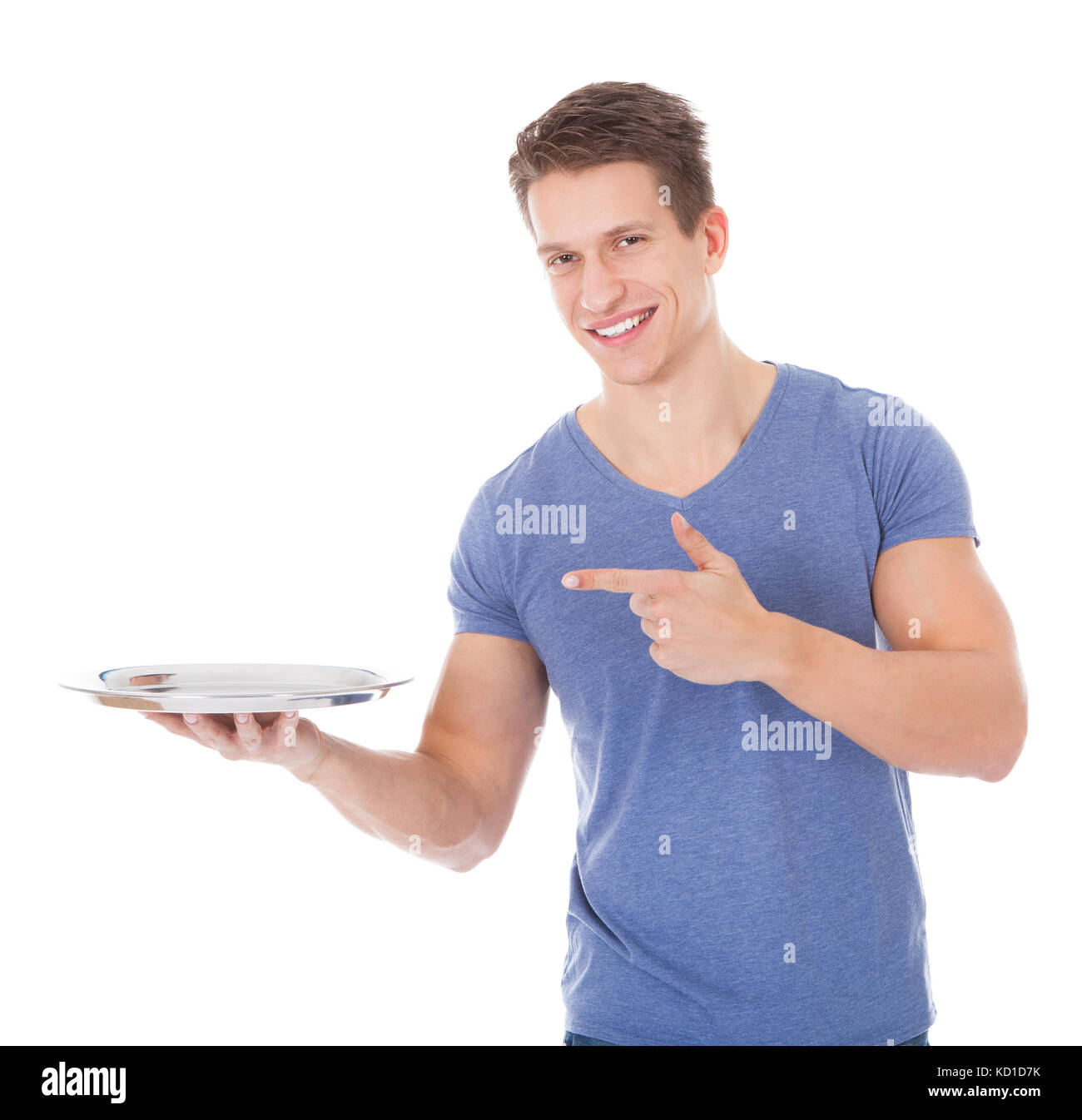 Happy Young Man Holding Empty Plate Over White Background Stock Photo