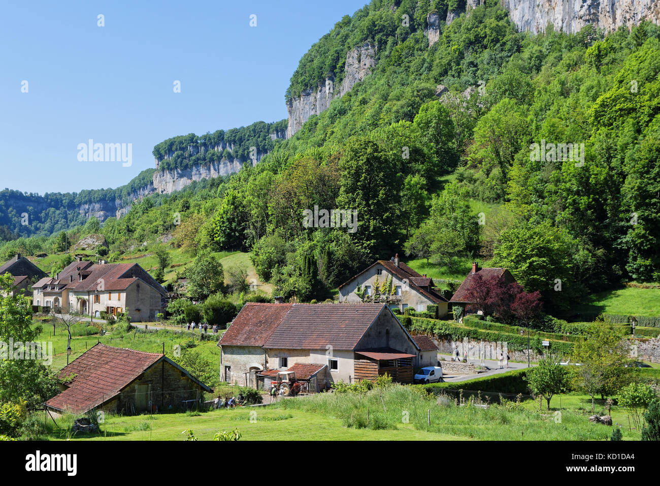 The village of Baume-les-Messieurs lies within the most extensive of the steephead valleys of the Jura escarpment, the 'Reculee de Baume', limestone c Stock Photo