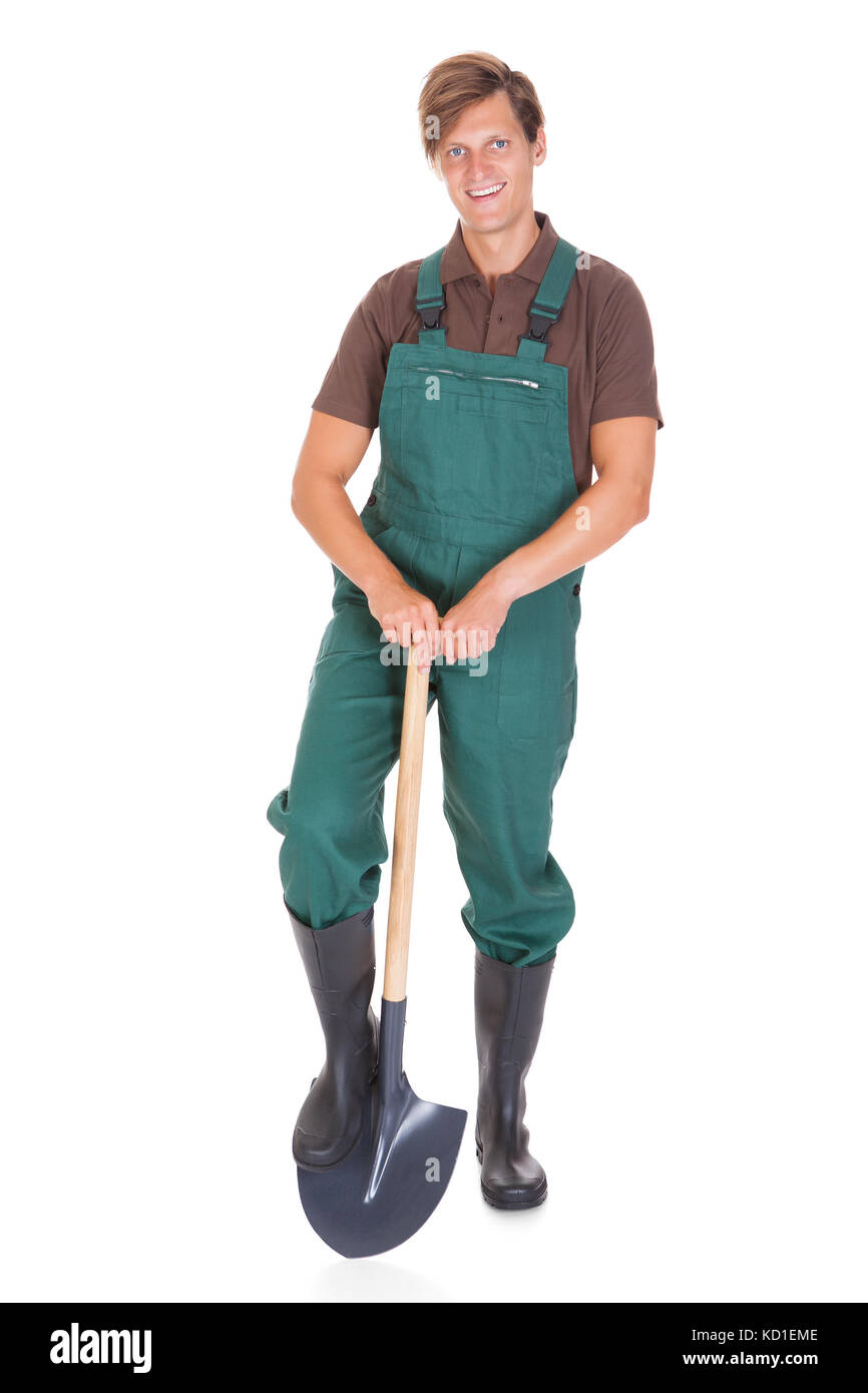Portrait Of Happy Young Male Gardener With Shovel On White Background ...