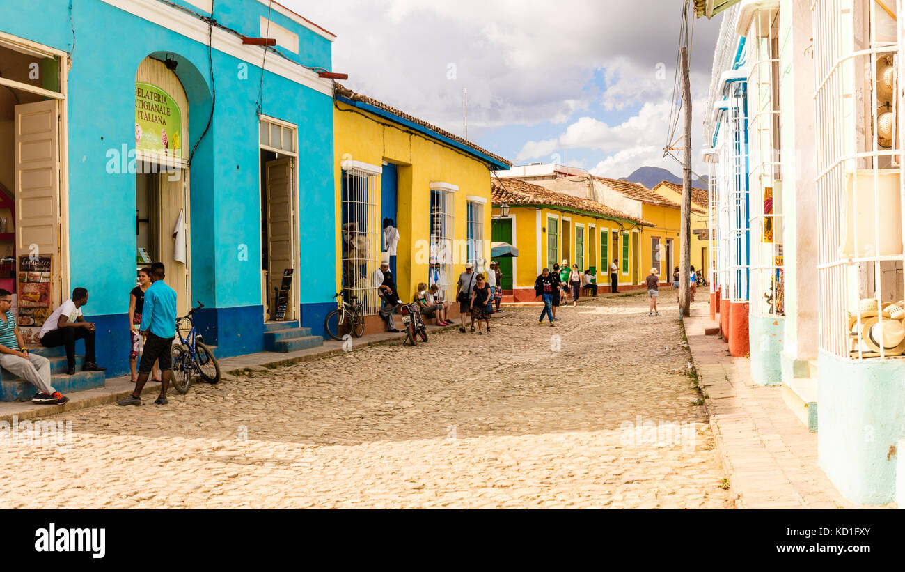 Spanish Colonial architecture with colourful houses,  cobblestone streets and people in a street scene, Trinidad,  Sancti Spíritus, Cuba, Caribbean Stock Photo