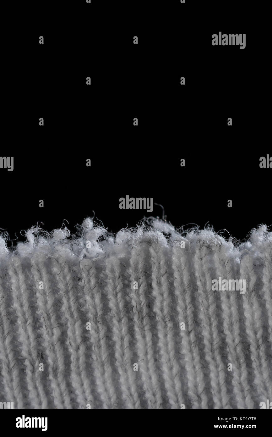 Close-up of the worn neckline of an old threadbare t-shirt - metaphor ...