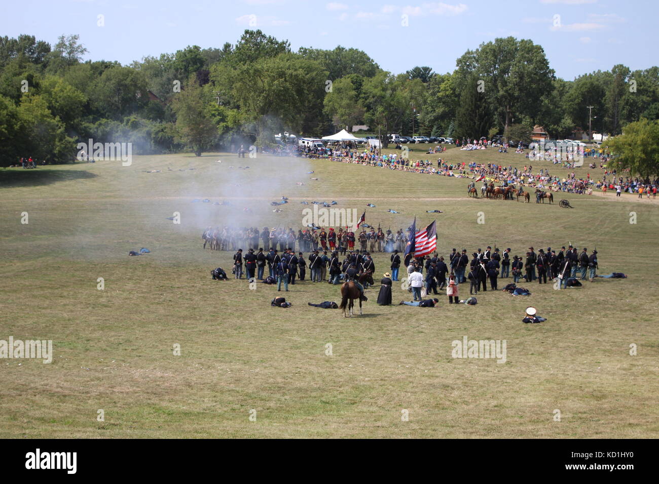 A civil war battle in Michigan at a festival with union and confederate
