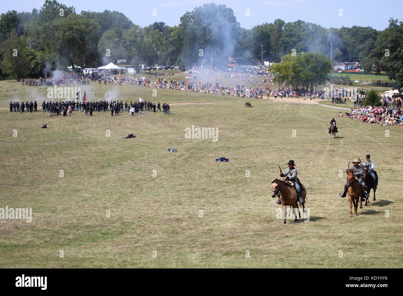A civil war battle in Michigan at a festival with union and confederate