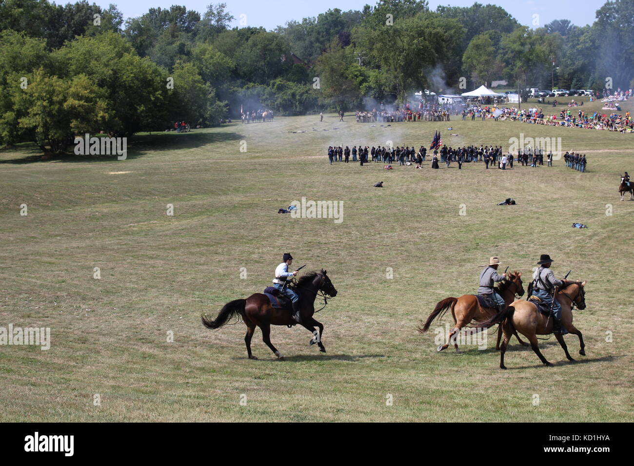 A civil war battle in Michigan at a festival with union and confederate
