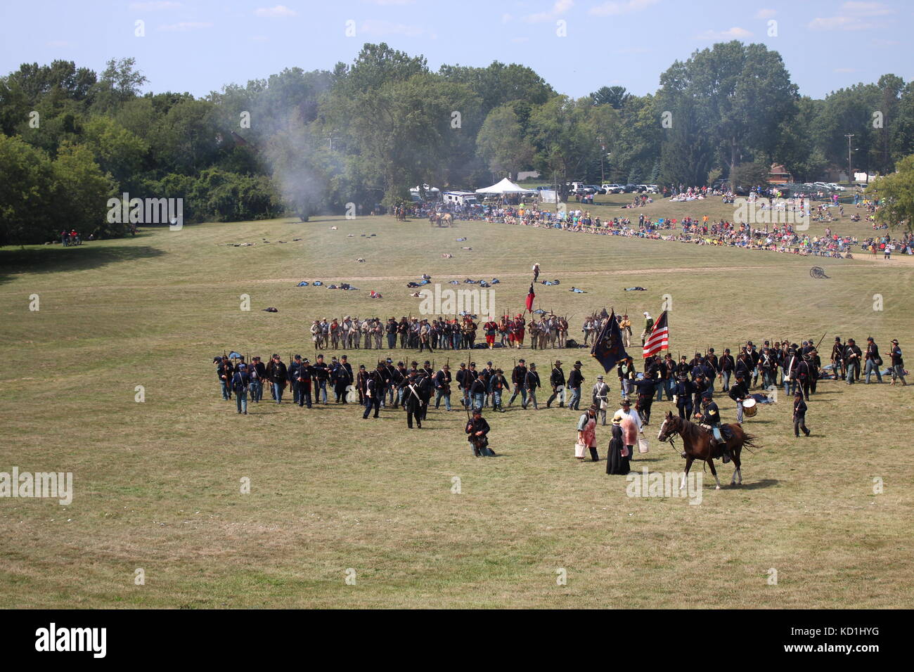 A civil war battle in Michigan at a festival with union and confederate