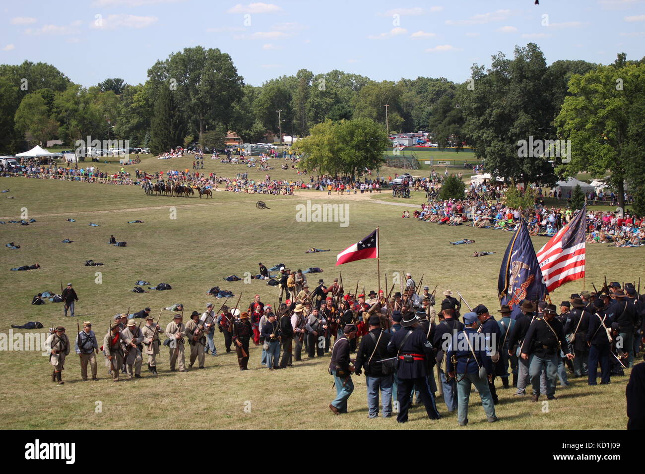 A civil war battle in Michigan at a festival with union and confederate