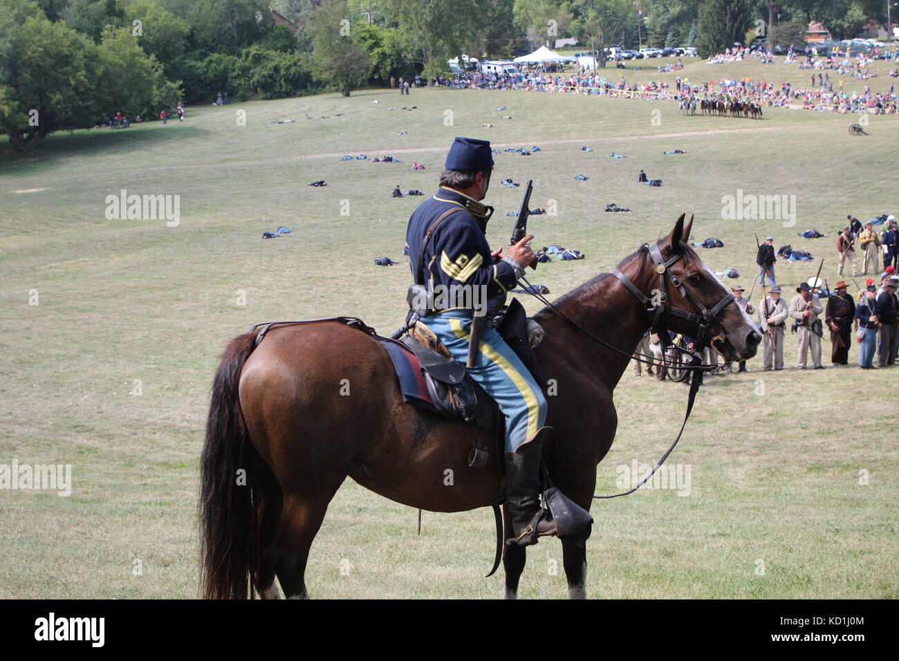 A civil war battle in Michigan at a festival with union and confederate