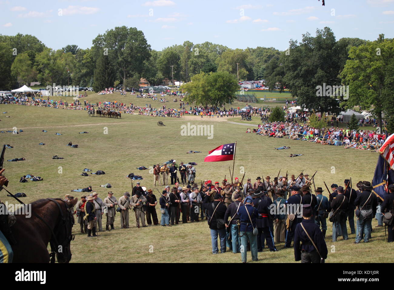 A civil war battle in Michigan at a festival with union and confederate