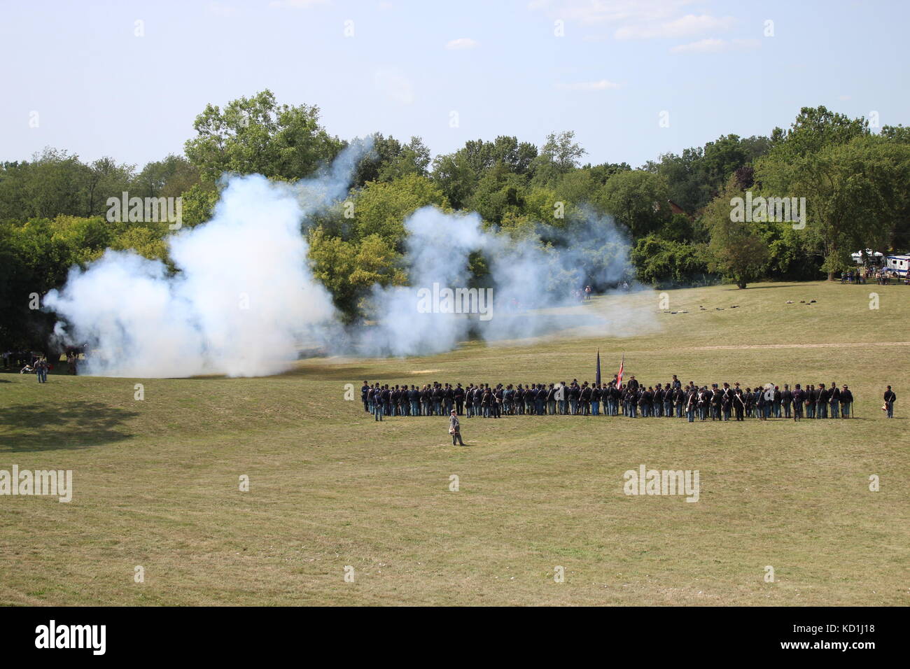 A civil war battle in Michigan at a festival with union and confederate