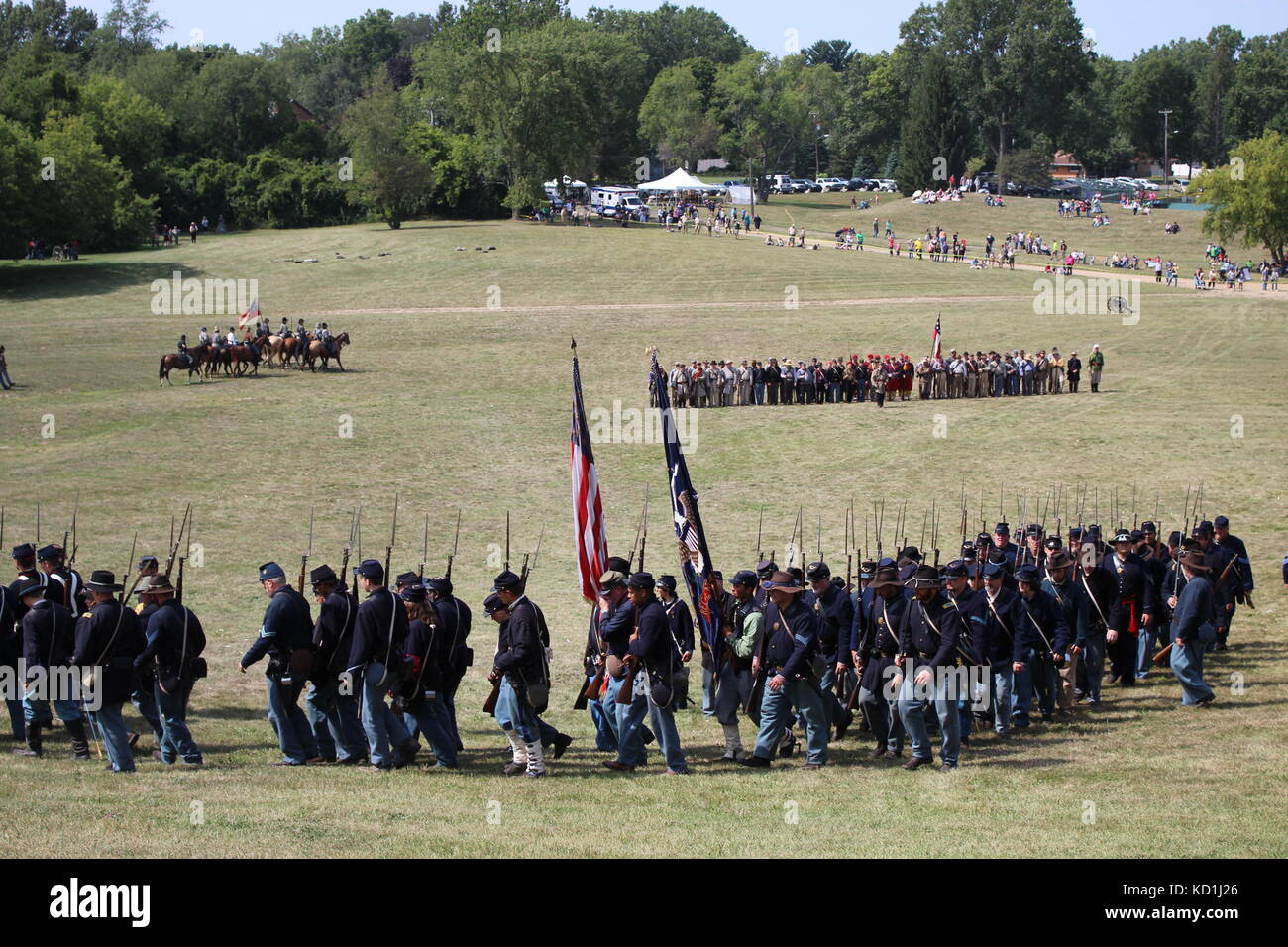 A civil war battle in Michigan at a festival with union and confederate