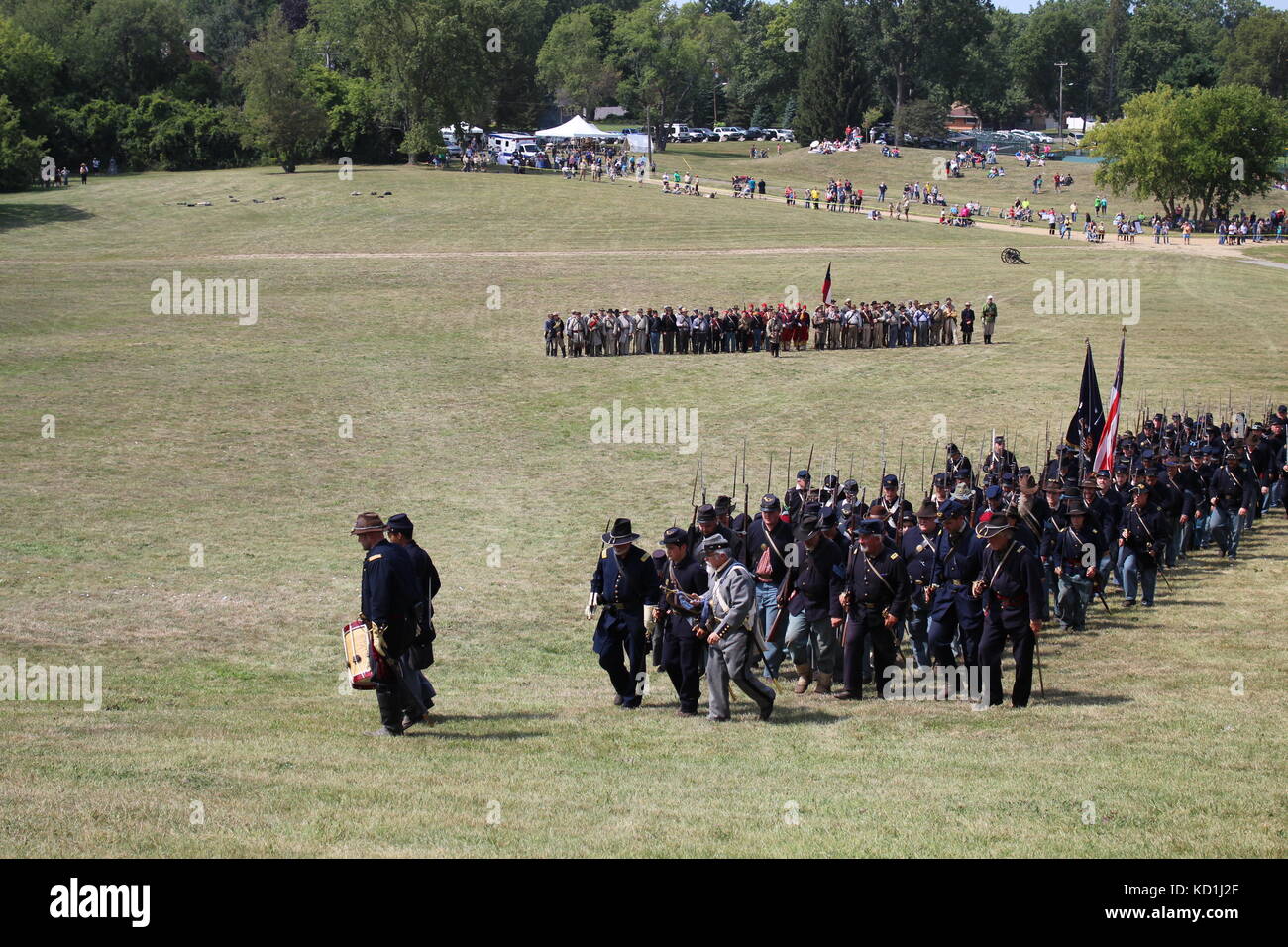 A civil war battle in Michigan at a festival with union and confederate