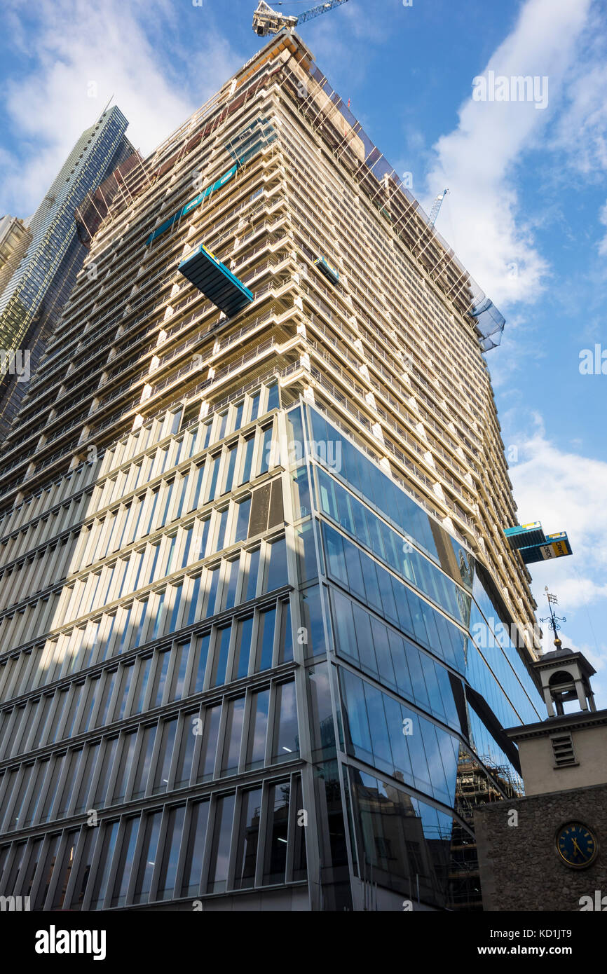 Exterior cladding being installed 100 Bishopsgate next to St Ethelburga's Centre, City of London, UK Stock Photo