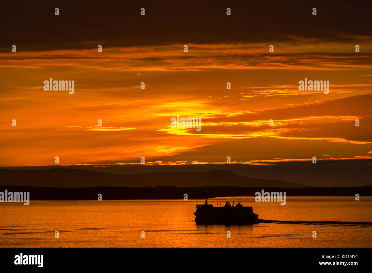 Tthe Northlink ferry, the MV Hrossey, at sunset, from Mull Head, Deerness, Orkney Mainland, Scotland, UK. Stock Photo