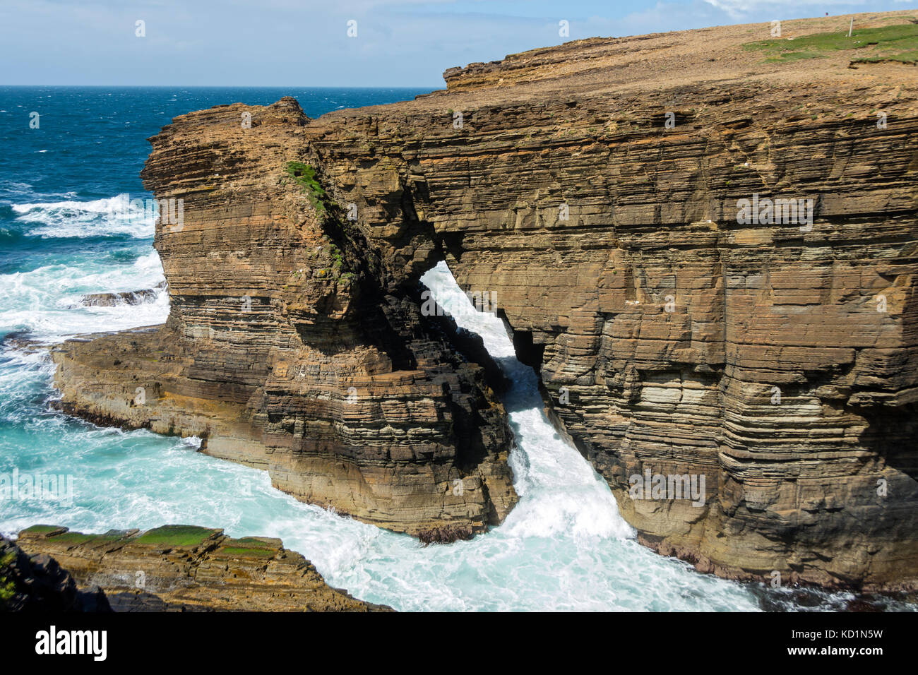 Rock arch near the Brough of Bigging at Yesnaby, Orkney Mainland, Scotland, UK. Stock Photo