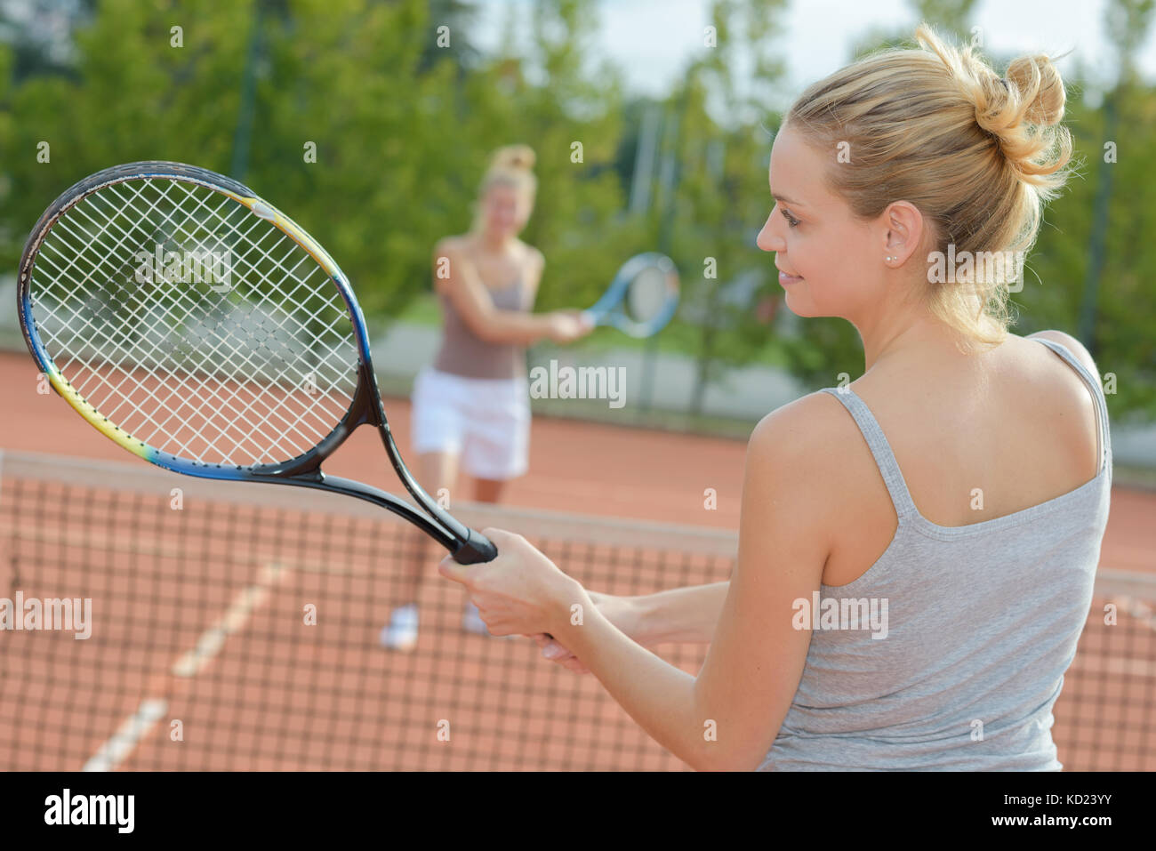 two attractive female tennis players discussion at the court Stock Photo Alamy
