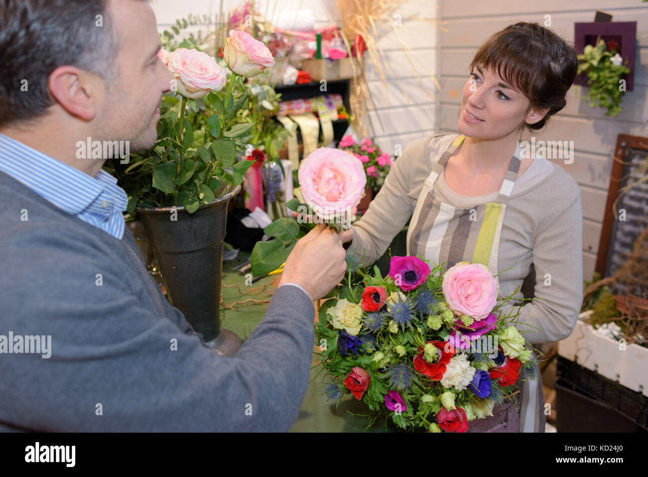 Florist serving customer Stock Photo Alamy