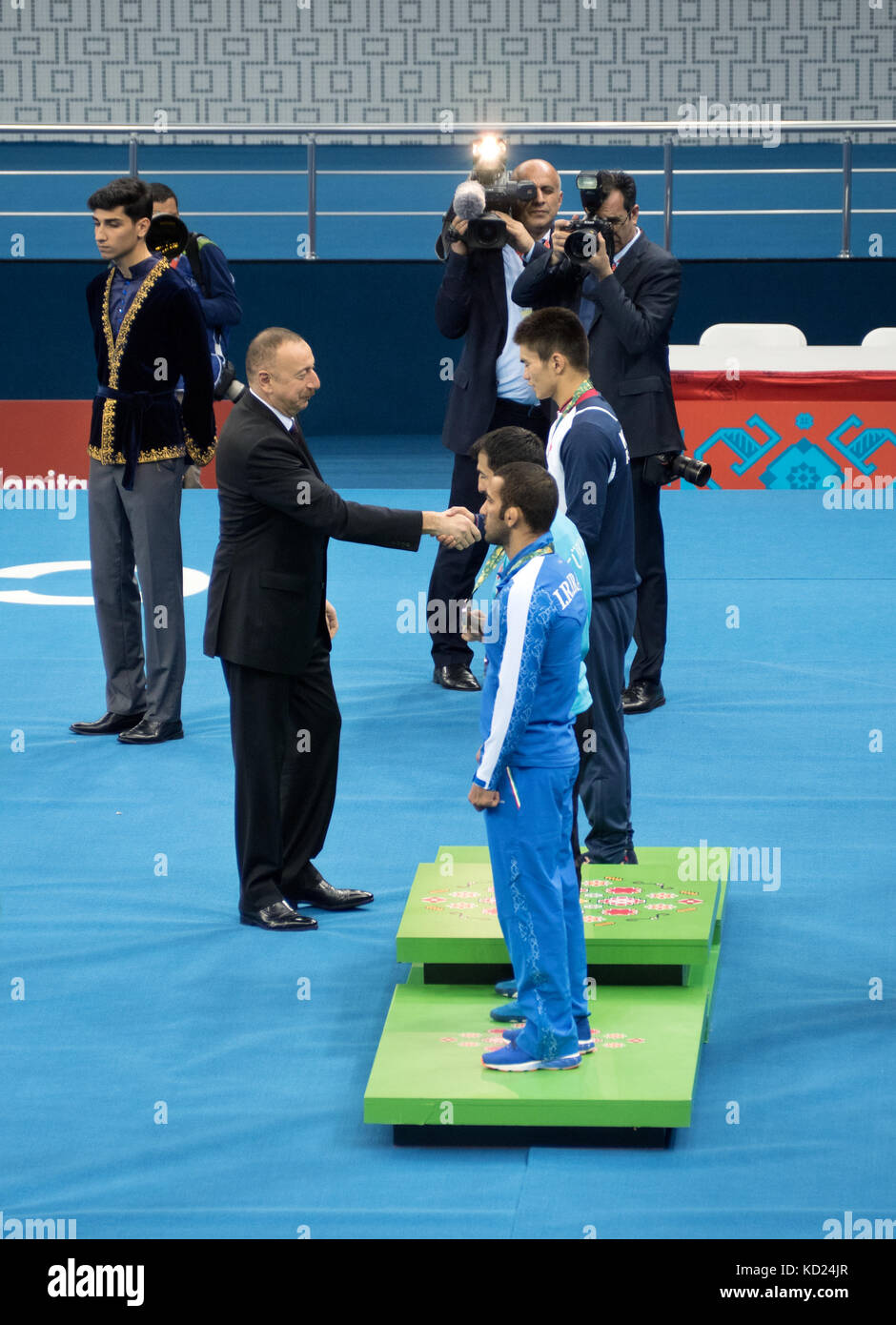 Baku, Azerbaijan - May 18, 2017 : Predident Ilham Aliyev presents medals to winners of Greco-Roman wrestling competition held as part of the 4th Islam Stock Photo