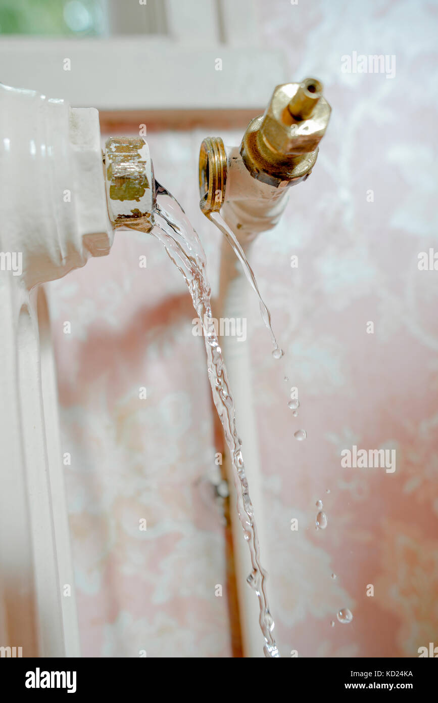 Pipe broken away from radiator, leaking water Stock Photo Alamy