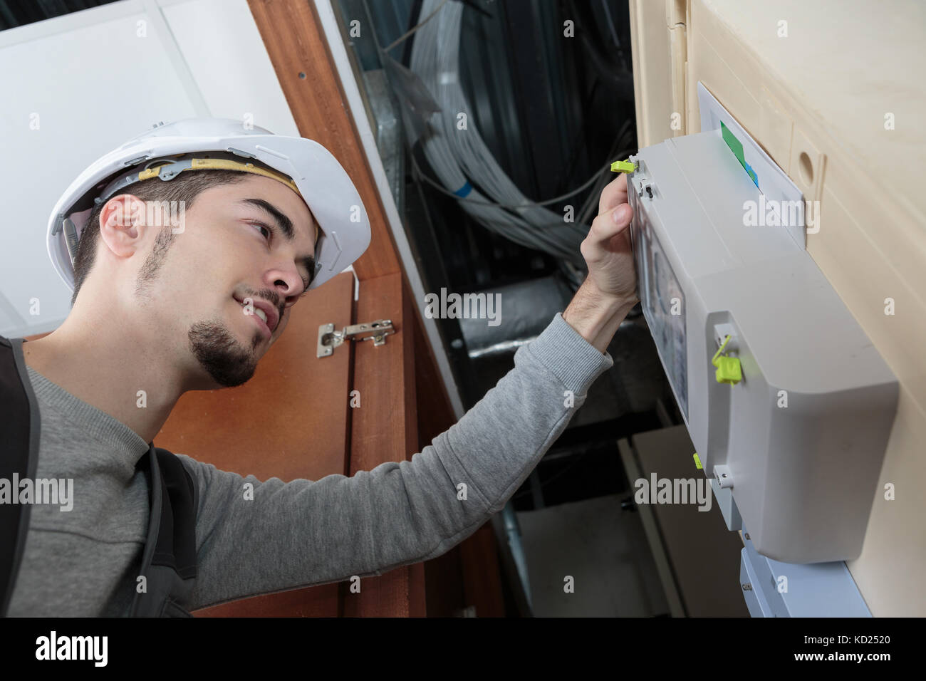 electrician inspection the switchboard Stock Photo - Alamy