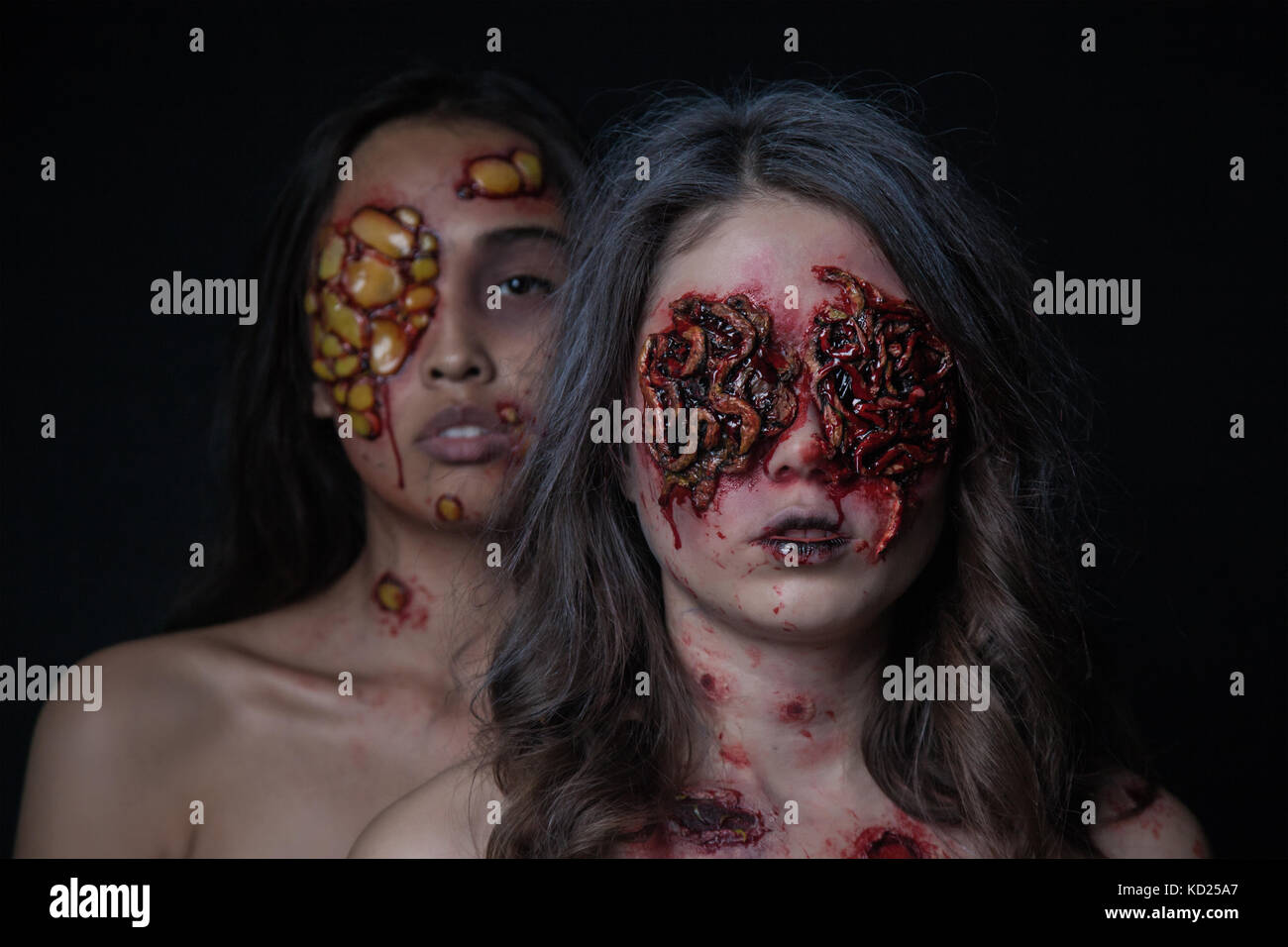 Girls with a realistic Halloween makeup. Girls with sores and blood on  their face Stock Photo - Alamy