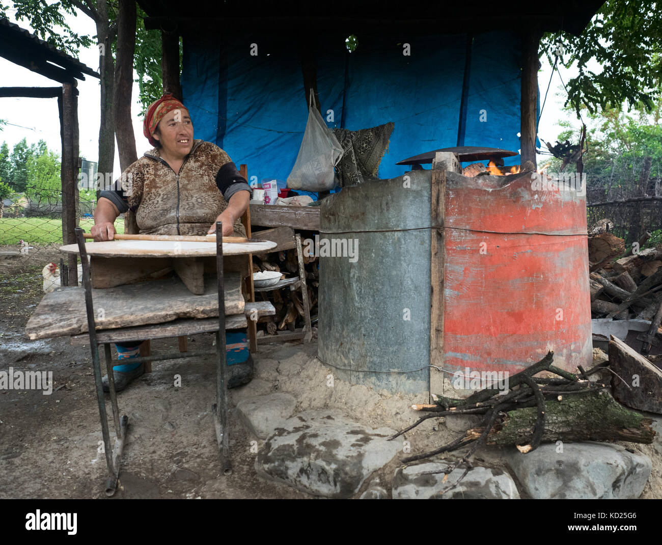 Portrait of a woman making traditional Caucasus bread along the road, northern Azerbaijan Stock Photo
