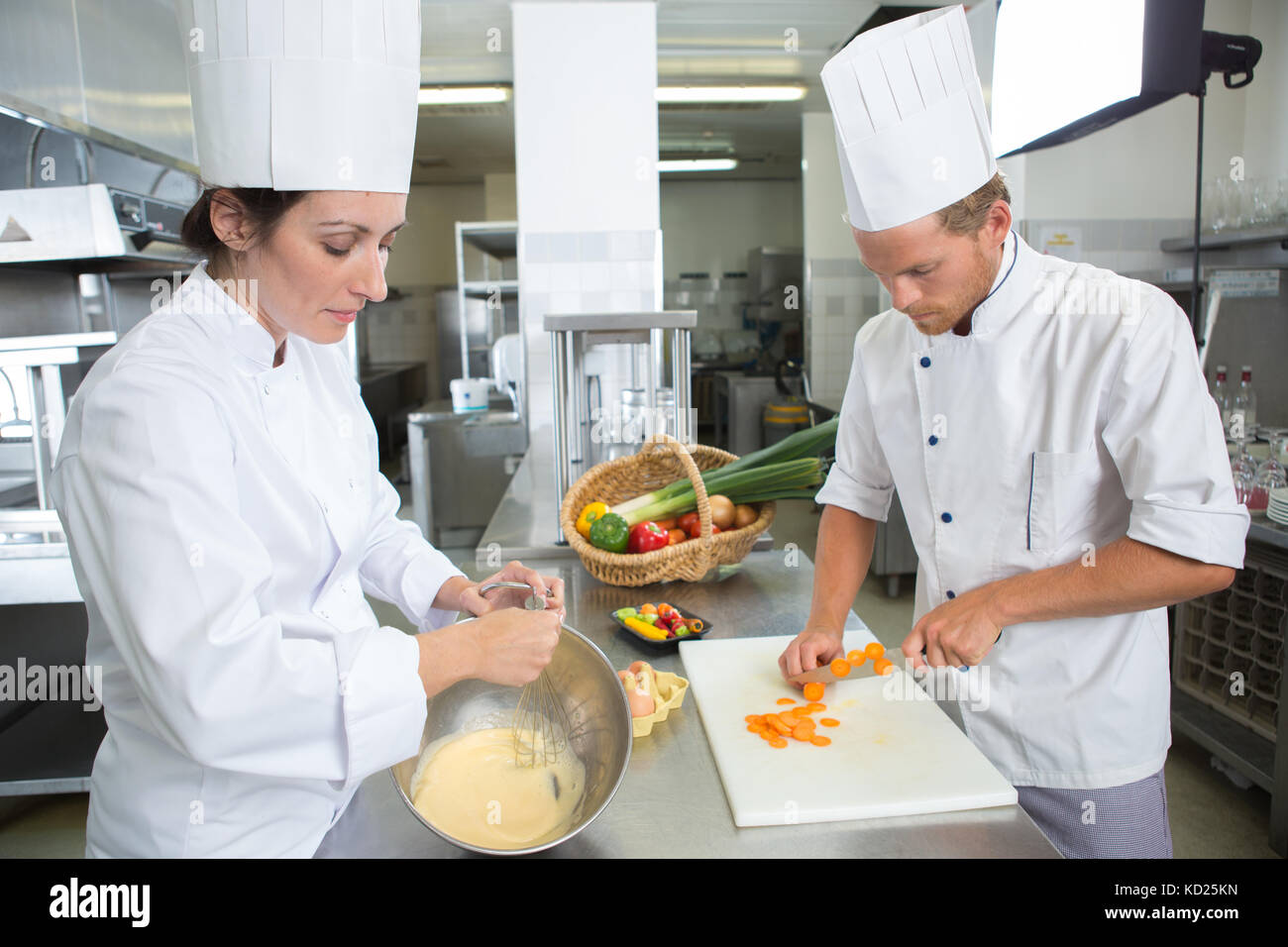 In his kitchen with his assistant chefs hires stock photography and