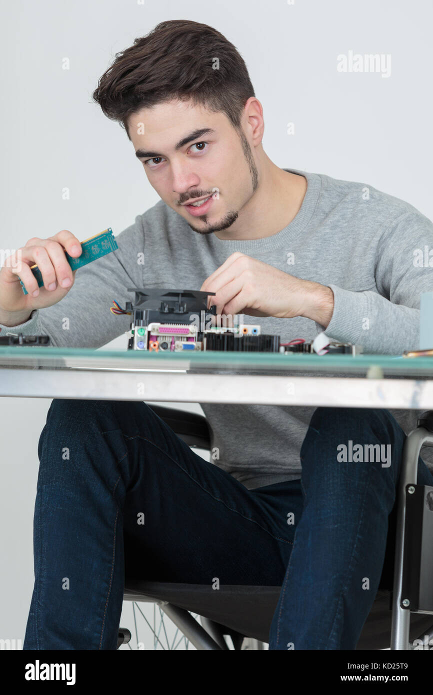 Image showcasing handicapped electronic parts assembler Stock Photo - Alamy