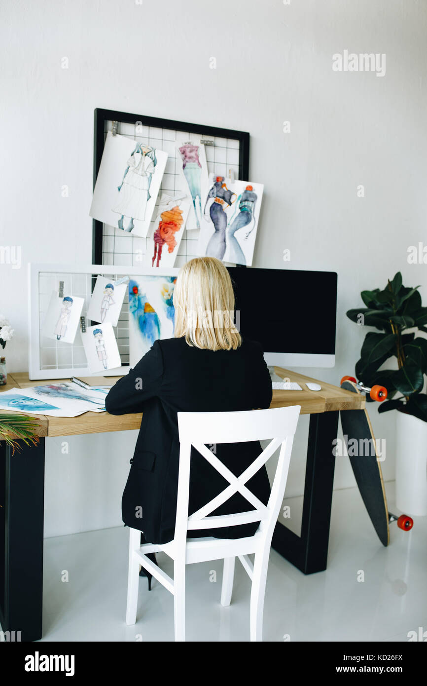 fashion designer working with sketches Stock Photo - Alamy