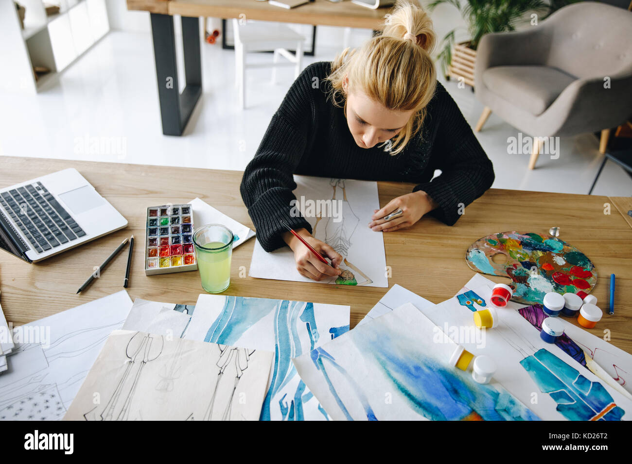 Fashion designer drawing sketch Stock Photo - Alamy
