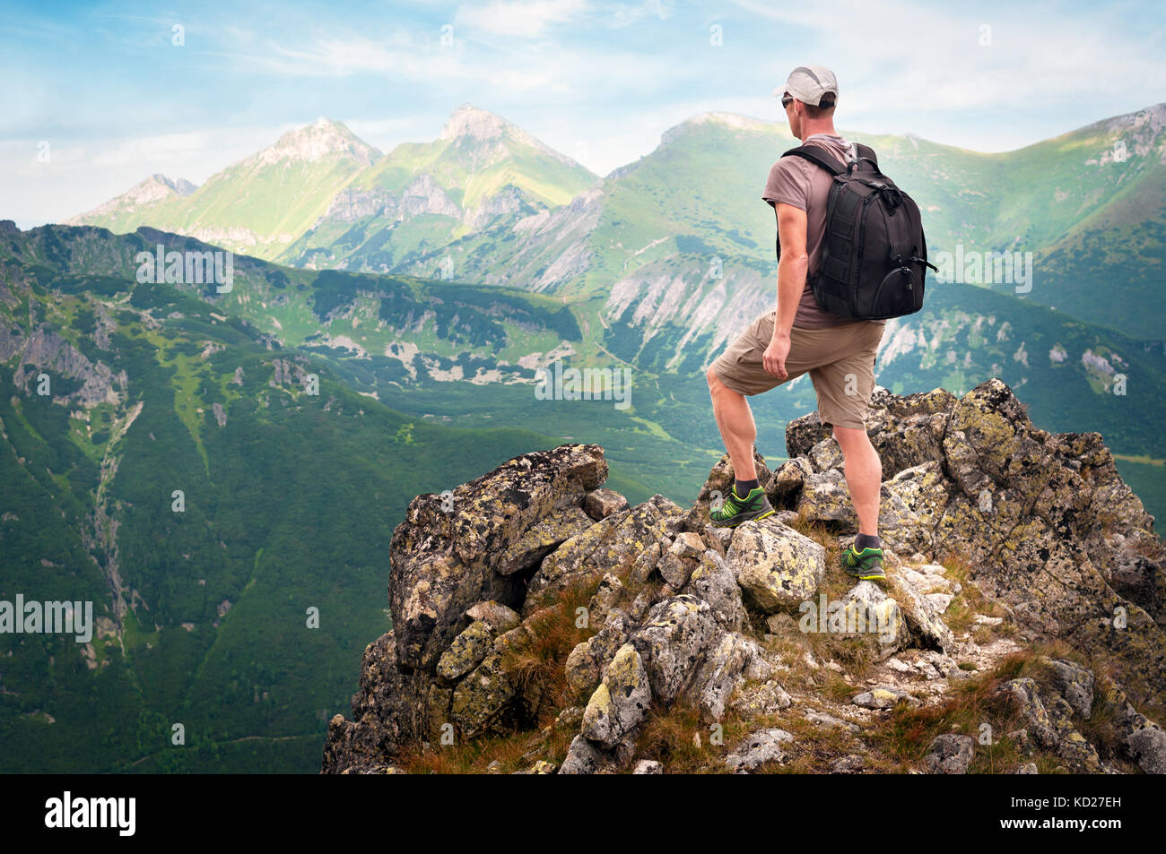 Hiker standing on top of the mountain Stock Photo
