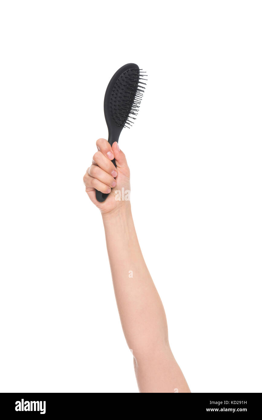 hand holding hairbrush Stock Photo Alamy