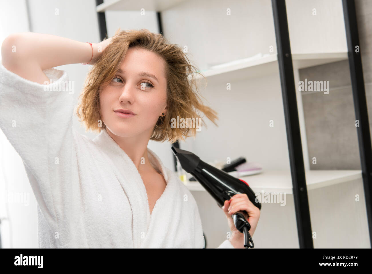 woman drying hair Stock Photo