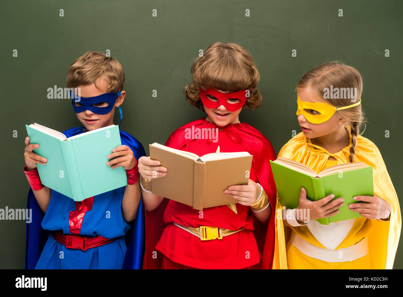 superheroes reading books Stock Photo