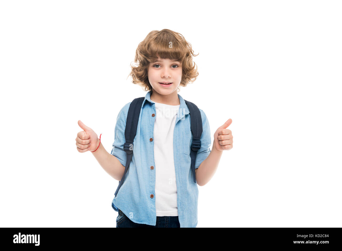 schoolboy showing thumbs up Stock Photo - Alamy